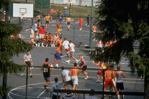 A wide view of athletes competing across multiple full courts
