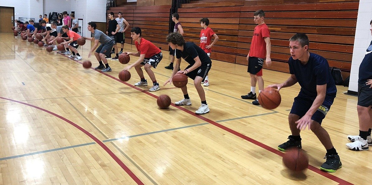 Athletes running ball-handling drills at the camp